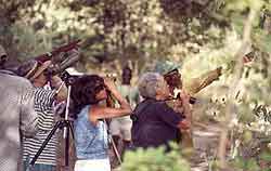 Jonathan Baya, a guide at the forest shows some visitors around.