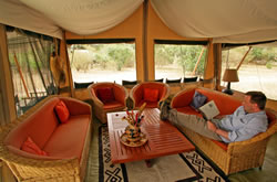 Relaxing at JK Mara Camp. Copyright Bill Gozansky